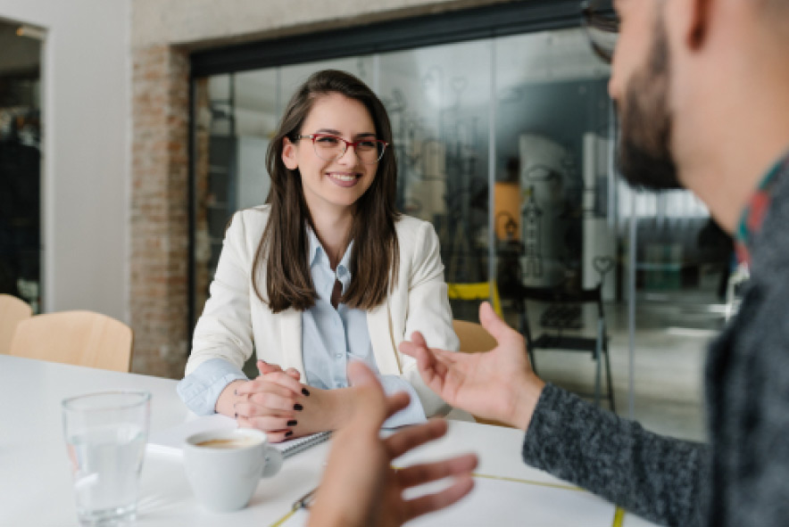 A prospective social work student sits in an interview. 